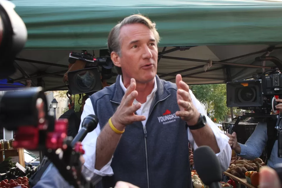 Glenn Youngkin gesturing with his hands while speaking to the media and the public while campaigning for governor of Virginia at the Alexandria Farmers Market.